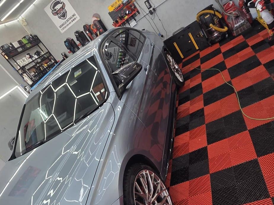A BMW under the hexagon lights in the Connah's Quay studio