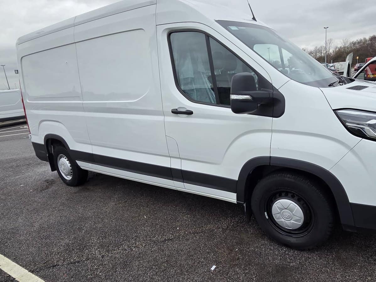 The same van after the wash, the paint clean and white again