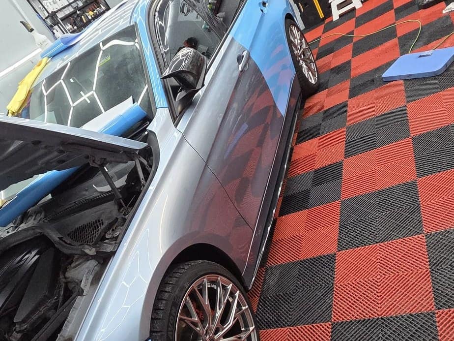 A colour-change wrap going onto a BMW in the Connah's Quay studio